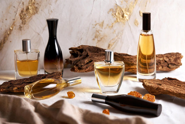 Unisex Arabian fragrances arranged with oud wood amber resin and neutral premium details for Soghaat fragrance guide