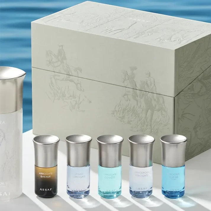 Assaf Aura Collection & Sunglass Gift Set: includes Aura Pegasus, 5 Arrogate mini perfumes, and sunglasses. Beige box with embossed equestrian scene.