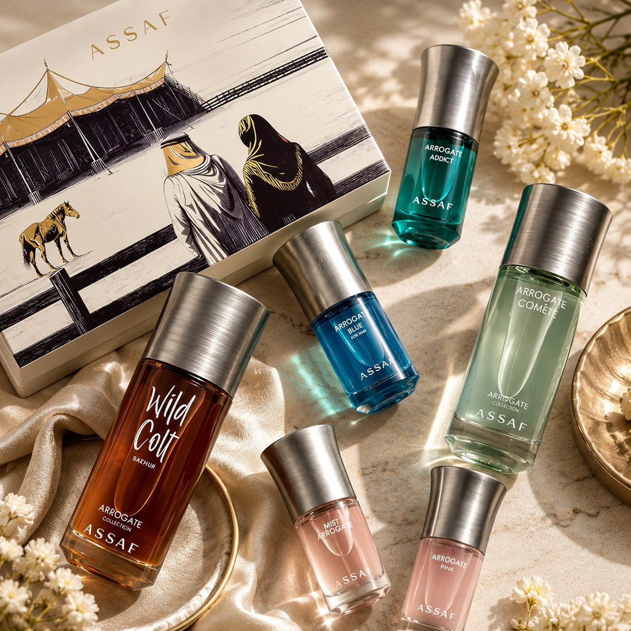 Assaf Bakhur Collection perfume gift set with six bottles: amber, blue, green, teal, and pink fragrances. Includes gift box with Arabic art.