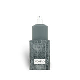 French Avenue Nomad 100ml Extrait de Parfum bottle with grey textured base and grey cap.