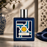 Rayhaan Cadiz Eau de Parfum in a dark blue bottle with a geometric label. Unisex amber woody oriental fragrance.