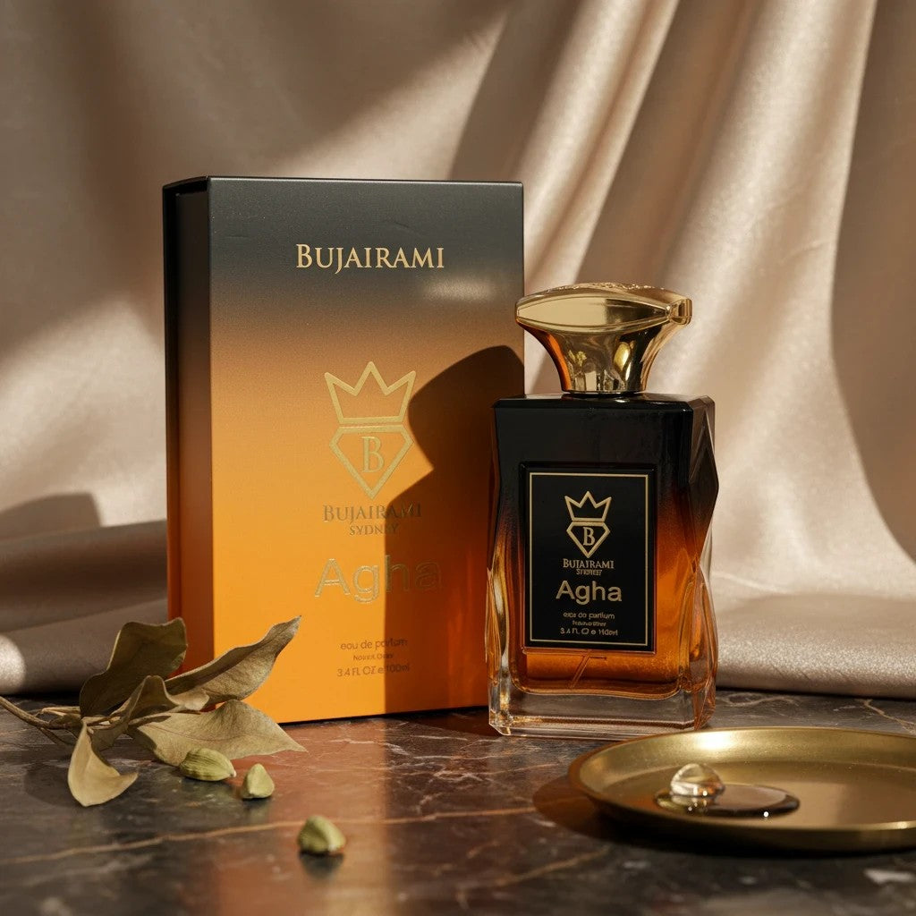 Soghaat Agha Eau de Parfum for men, 100ml bottle with a gradient orange and black box. Fresh woody aromatic fragrance.