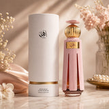 Soghaat Ahl 60ml Extrait de Parfum bottle and packaging. Pink fluted bottle with gold accents and cap. White cylindrical box.
