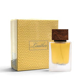 Soghaat Ahmed Al Maghribi Leather 50ml Eau de Parfum bottle with a wooden cap next to its textured gold box.