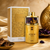 Soghaat Ajmal Aurum Elixir 75ml Eau de Parfum in a gold bottle with purple accents, displayed with its luxury box.