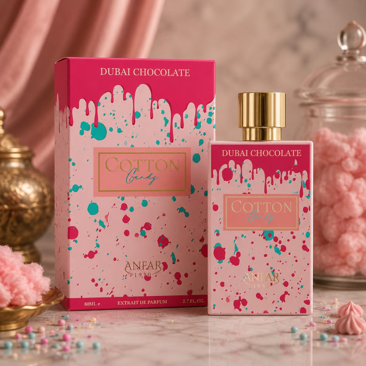 Soghaat Anfar Cotton Candy Extrait de Parfum bottle and box with pink and teal paint drip design on a marble table.
