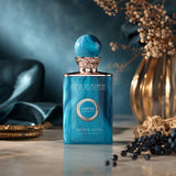 Soghaat Anfar London Bateig Azul Extrait de Parfum bottle with blue marble finish and round cap on a marble surface.