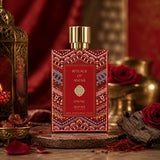 Soghaat Anfar London Divine Extrait de Parfum in a decorative red bottle with intricate patterns, surrounded by roses.