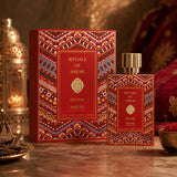 Soghaat Anfar London Divine Extrait de Parfum bottle and decorative red patterned box on a marble surface.