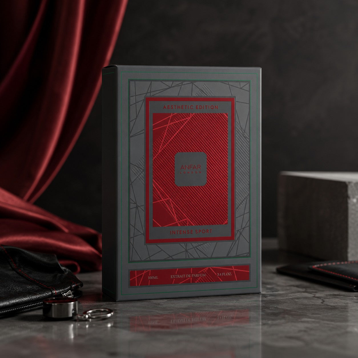 Soghaat Anfar London Intense Sport 100ml Extrait de Parfum box in grey and red packaging on a dark marble surface.
