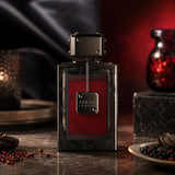 Soghaat Anfar London Intense Sport Extrait de Parfum bottle with a sleek black and red design on a dark table.