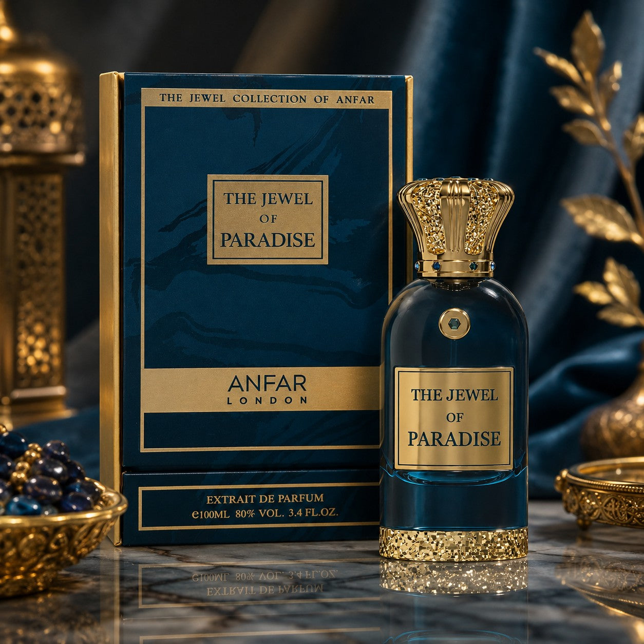 Soghaat Anfar London The Jewel of Paradise perfume bottle and box with gold crown cap on a marble table.