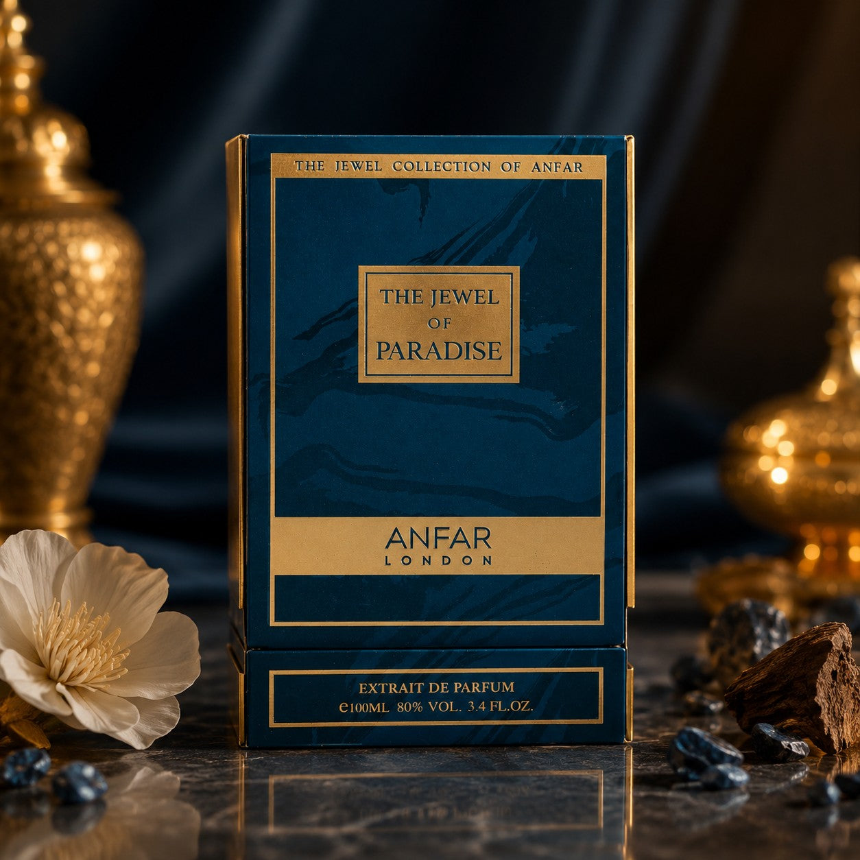 Soghaat Anfar London The Jewel of Paradise 100ml Extrait de Parfum in a deep blue and gold box on a marble surface.