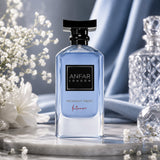 Soghaat Anfar London Midnight Frost Intense 100ml Extrait de Parfum in a blue glass bottle on a marble surface.