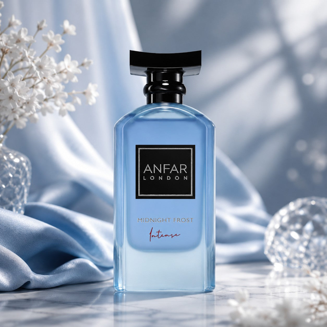 Soghaat Anfar London Midnight Frost Intense men's extrait de parfum in a blue glass bottle with a black cap.
