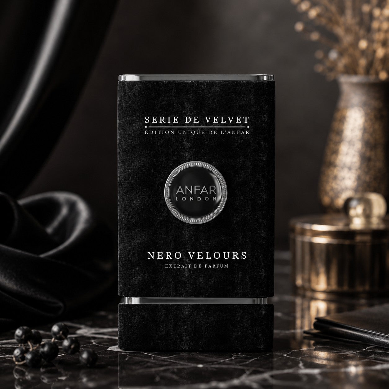 Soghaat Anfar London Nero Velours Extrait de Parfum in a black velvet-textured bottle on a dark marble surface.