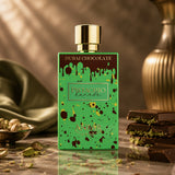 Soghaat Anfar Pistachio Kunafa Extrait de Parfum in a bright green bottle with chocolate drip design and gold cap.