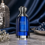 Soghaat Anfar Summer in Dubai Extrait de Parfum in a vibrant blue glass bottle with silver accents on a marble table.