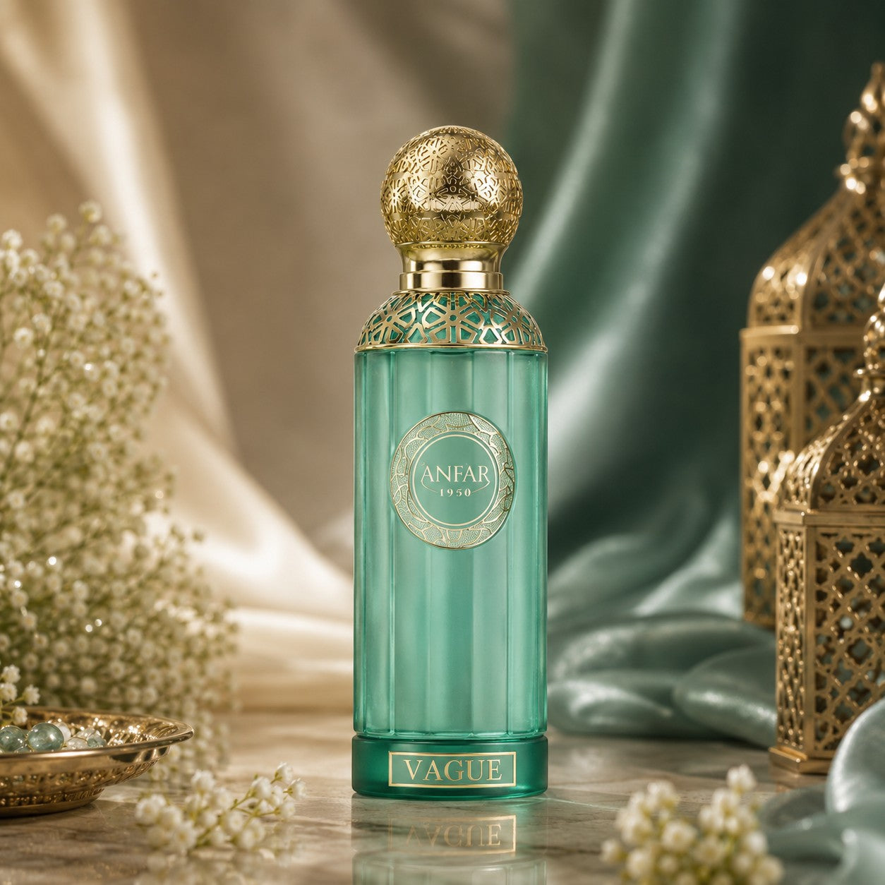 Soghaat Anfar Vague Extrait de Parfum in a green glass bottle with gold ornate cap, set against silk and lanterns.