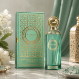 Soghaat Anfar Vague 100ml Extrait de Parfum in a green glass bottle with gold cap next to its matching patterned box.