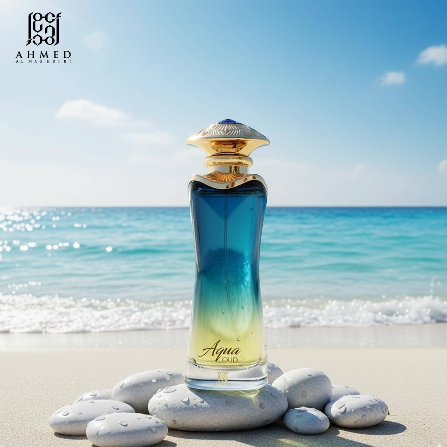 Ahmed Al Maghribi Aqua Oud Eau de Parfum bottle with blue and yellow gradient, on a beach with white stones.