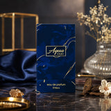 Soghaat Aqua Oud Eau de Parfum by Ahmed Al Maghribi in a blue marble-effect box with gold accents on a dark surface.