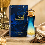 Soghaat Aqua Oud Eau de Parfum bottle and box with blue to yellow gradient glass, gold cap, and marble-effect packaging