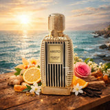 Soghaat Aristo 100ml Eau de Parfum, a gold bottle with vertical black stripes, featuring ginger, lemon, orange, vanilla, and rose accents.