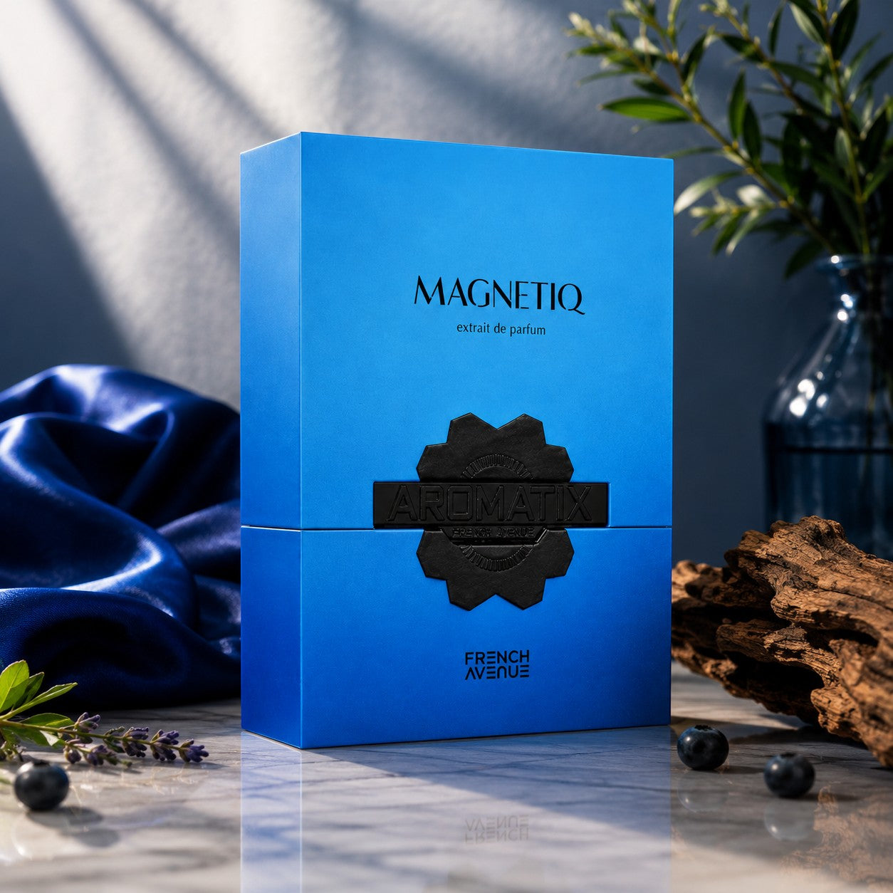 Soghaat Aromatix Magnetiq Extrait de Parfum by French Avenue in a vibrant blue box on a marble surface.