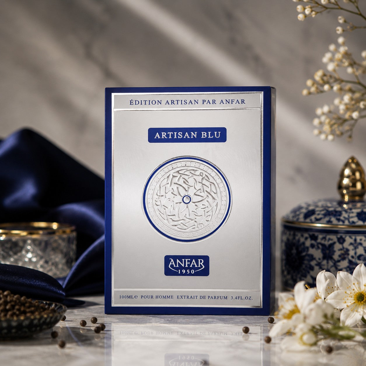 Soghaat Artisan Blu by Anfar 100ml Extrait de Parfum box in blue and silver, displayed with elegant floral decor.