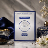 Soghaat Artisan Blu by Anfar 100ml Extrait de Parfum box in blue and silver, displayed with elegant floral decor.