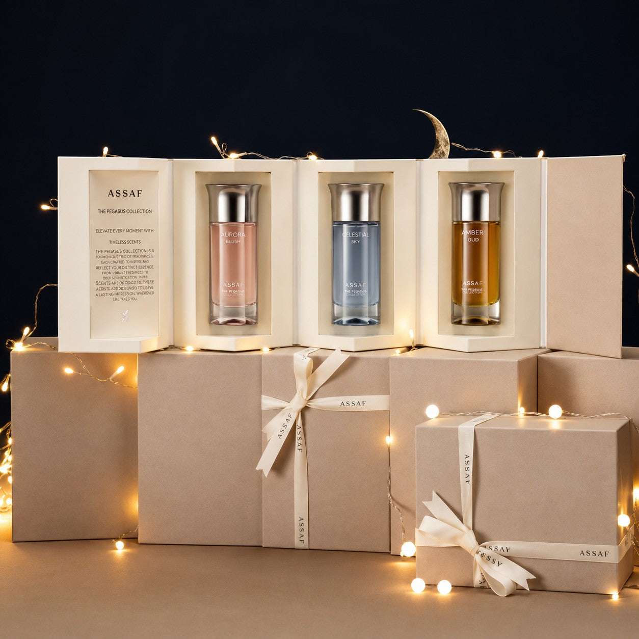 Assaf Pegasus Collection gift set featuring three 100ml Eau de Parfum bottles: Aurora Blush (pink), Celestial Sky (blue), and Amber Oud (amber).