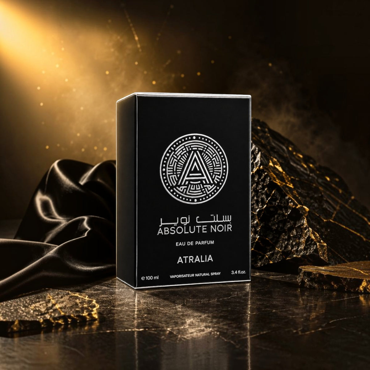 Soghaat Atralia Absolute Noir 100ml Eau de Parfum bottle in black packaging on a dark, textured surface with gold light.