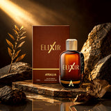 Soghaat Atralia Elixir 100ml Eau de Parfum bottle and box on a stone surface with golden lighting and foliage.