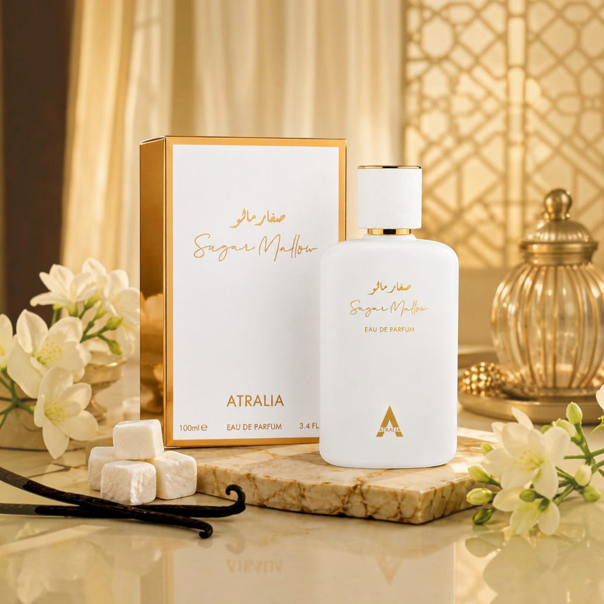 Soghaat Atralia Sugar Mallow 100ml Eau de Parfum bottle and box with vanilla and marshmallow on a marble surface.