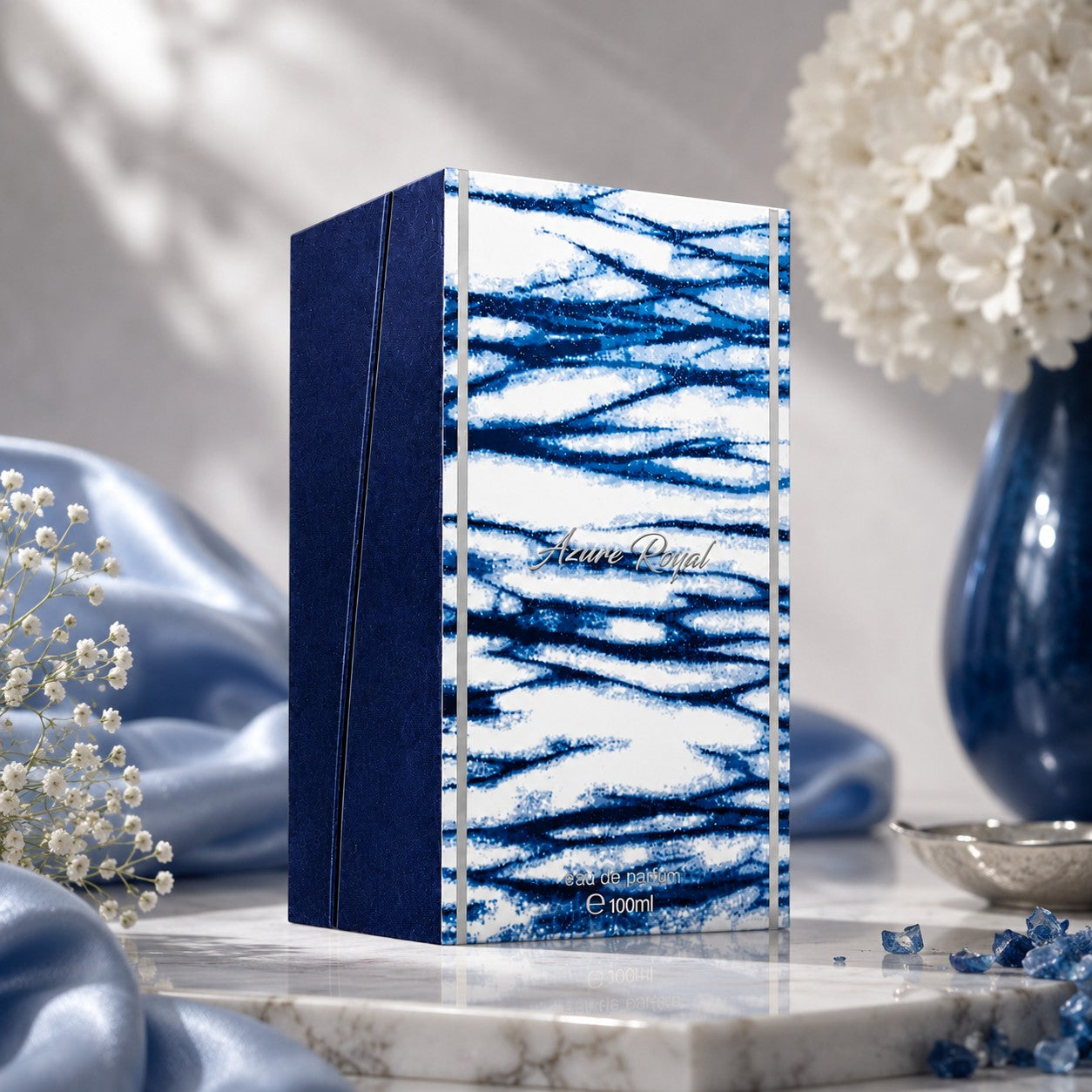 Soghaat Ahmed Al Maghribi Azure Royal 100ml Eau de Parfum box with blue and white abstract design on a marble surface.