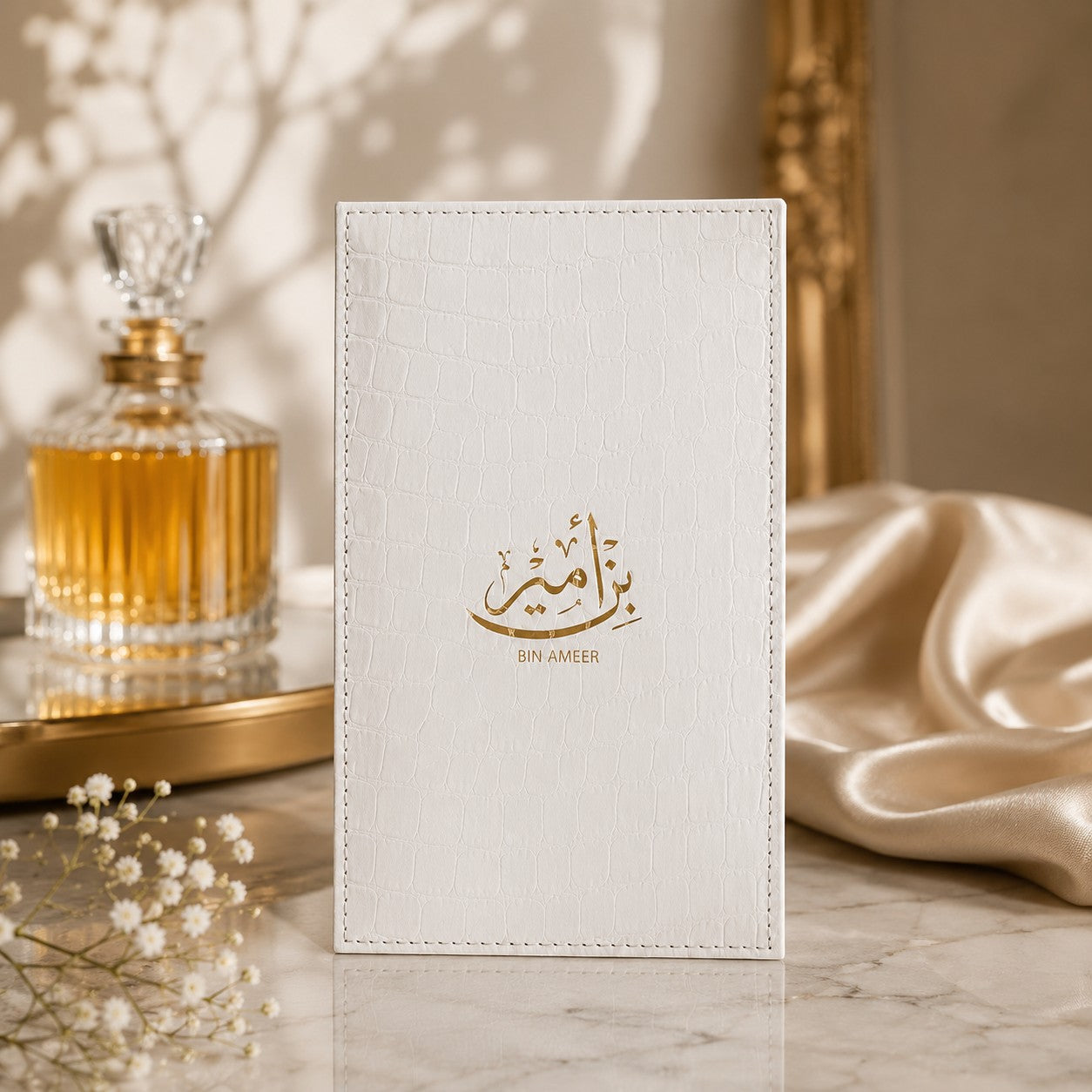 Soghaat Bin Ameer 90ml Extrait de Parfum for men, white croc-embossed case with gold Arabic calligraphy and text.