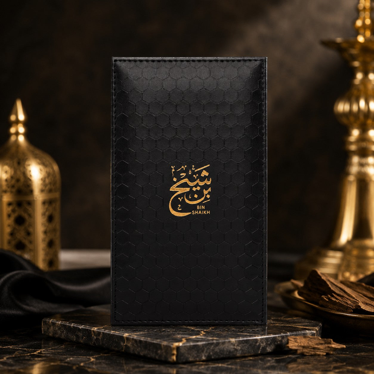 Soghaat Bin Shaikh 90ml Extrait de Parfum for men, amber oud woody fragrance with gold Arabic script on a black textured case.