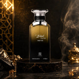 Soghaat Ahmed Al Maghribi Black Fume 100ml Extrait de Parfum bottle on a dark marble pedestal with smoky background.