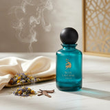 Soghaat Blue Laverne Bakhur 100ml Eau de Parfum in a teal glass bottle with a wooden cap. Fresh woody aromatic fragrance.