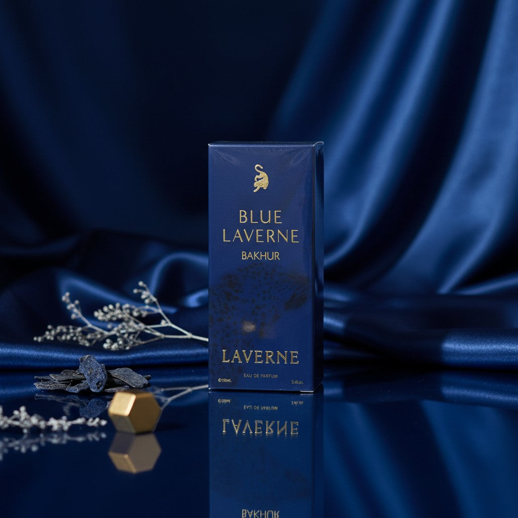 Blue Laverne Bakhur Eau de Parfum by Soghaat in a deep blue box, set against a draped blue satin background.
