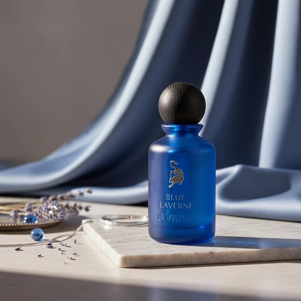 Soghaat Blue Laverne Eau de Parfum bottle with a wooden cap, featuring a blue frosted glass bottle and silver emblem.