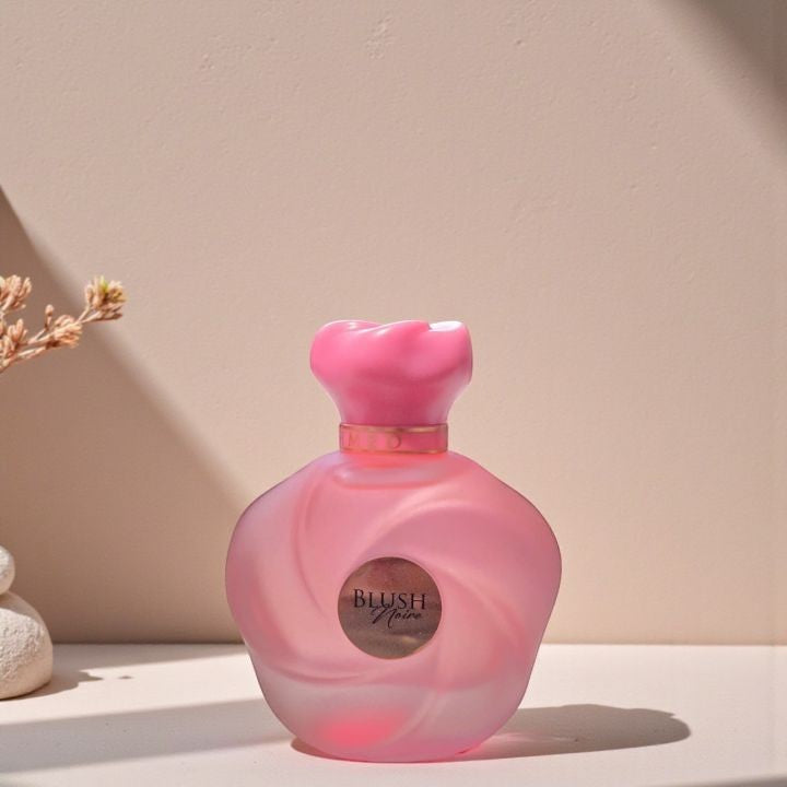 Soghaat Blush Noire 75ml Extrait de Parfum, a pink frosted glass bottle with a pink cap, featuring a gold label.