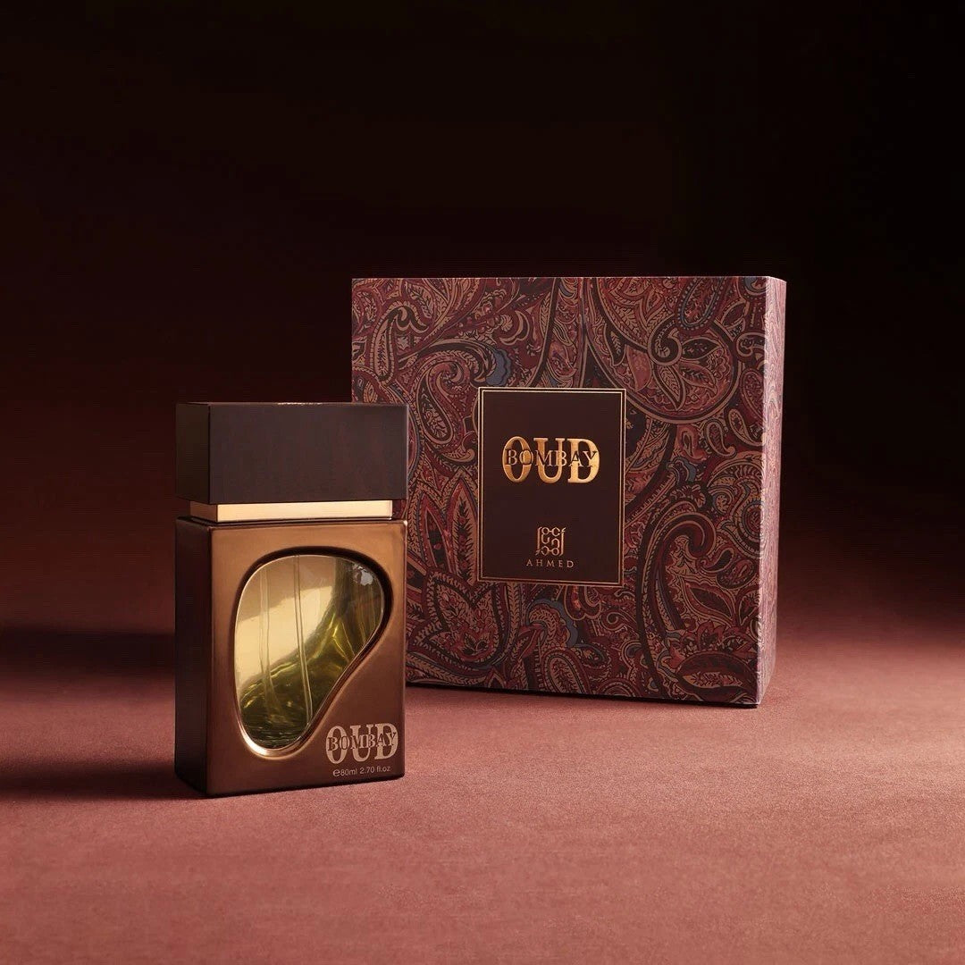 Soghaat Bombay Oud 80ml Eau de Parfum bottle with gold accents and paisley patterned box. Unisex woody, amber, leathery fragrance.