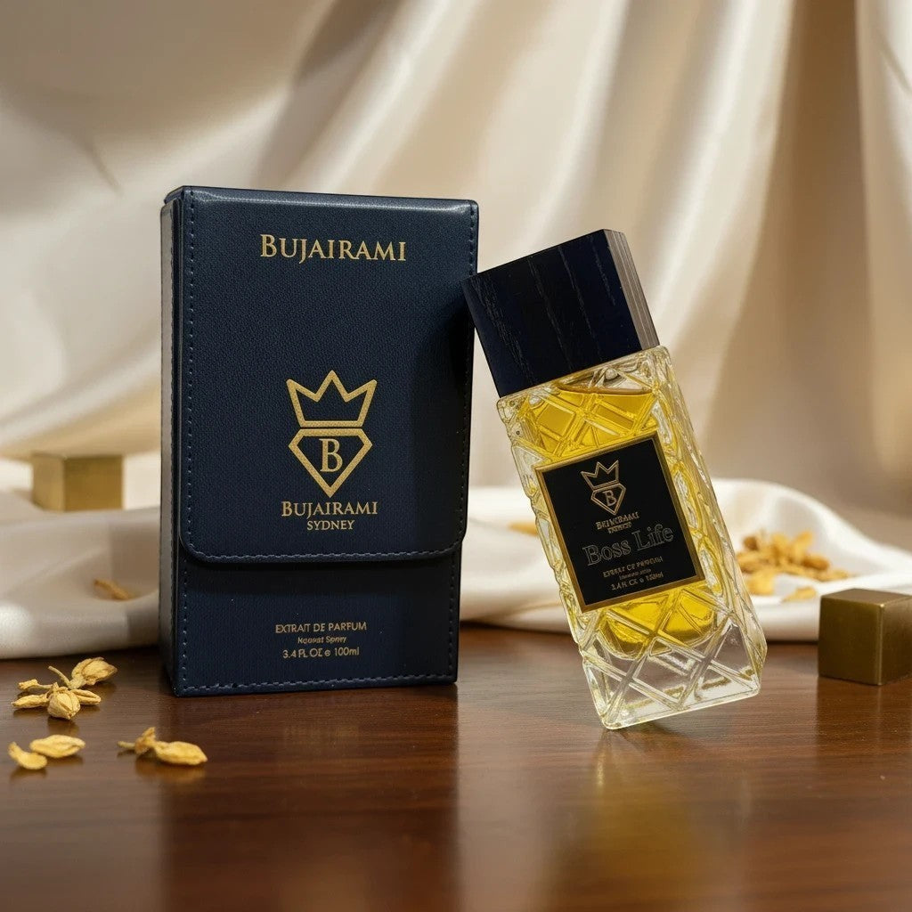 Soghaat Boss Life 100ml Extrait de Parfum for unisex, featuring a clear glass bottle with yellow liquid and a dark blue cap, next to its navy blue presentation box.