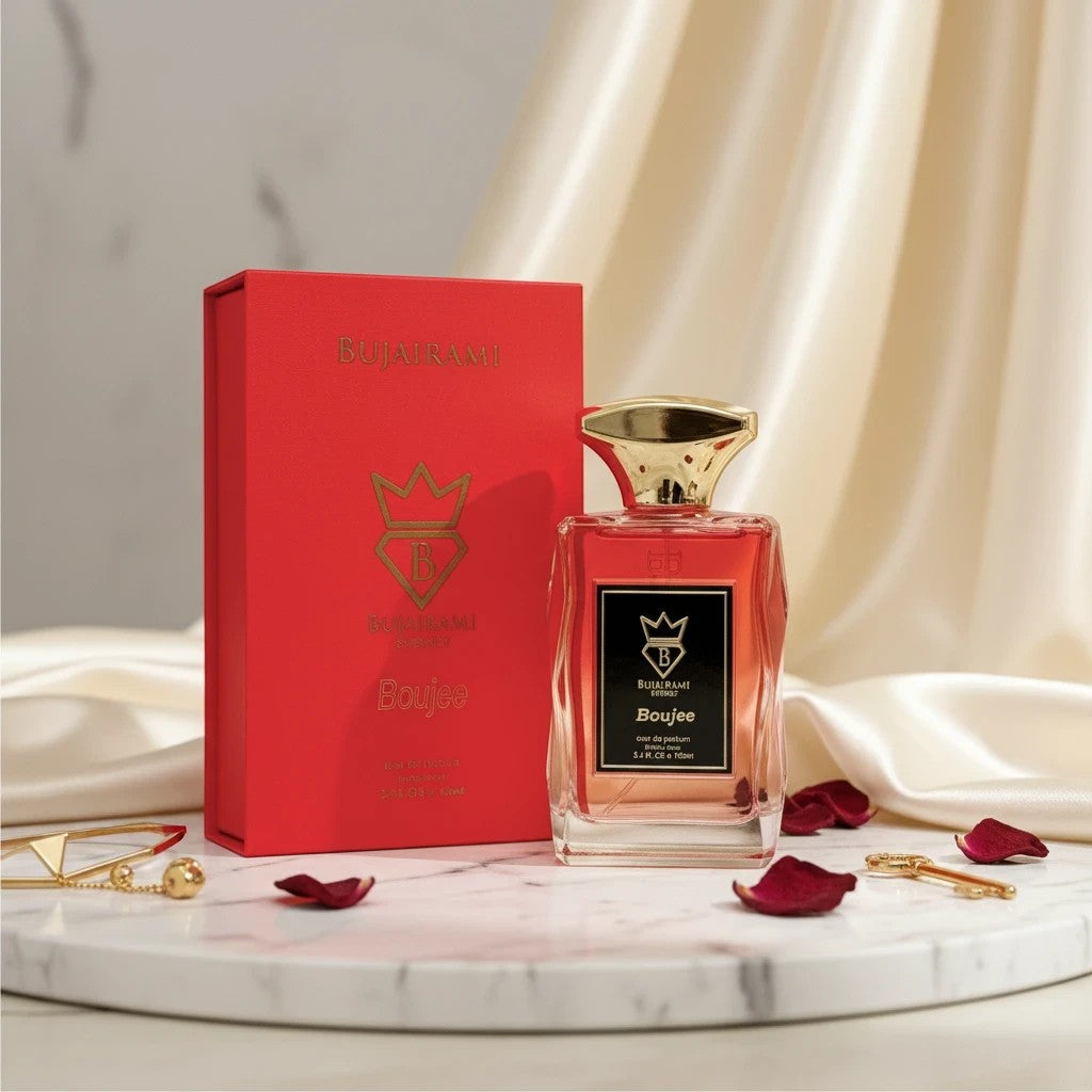 Soghaat Boujee 100ml Eau de Parfum for women, a fruity floral woody fragrance with a gold cap and red box.