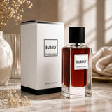 Soghaat Bubbly Eau de Parfum by Fragrance World in a glass bottle with amber liquid and matching white box on marble.