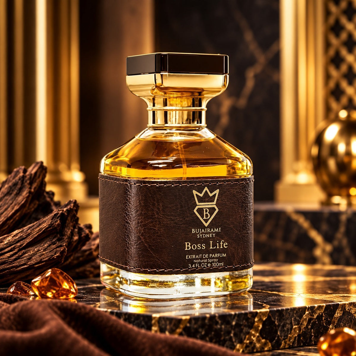 Soghaat Bujairami Boss Life 100ml Extrait de Parfum in a glass bottle with a leather label on a marble surface.