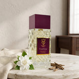 Soghaat Bujairami Breathless 100ml Extrait de Parfum bottle with a deep purple cap, white flower, and oud wood chips.