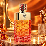 Soghaat Bujairami Candy Carousel 100ml Eau de Parfum in a vibrant orange and red honeycomb glass bottle with gold cap.